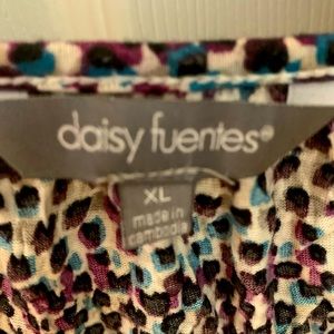 A pullover blouse with 3/4 sleeves…. Worn once, no rips.